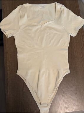 OQQ Cream Short-Sleeve One-Piece Bodysuit